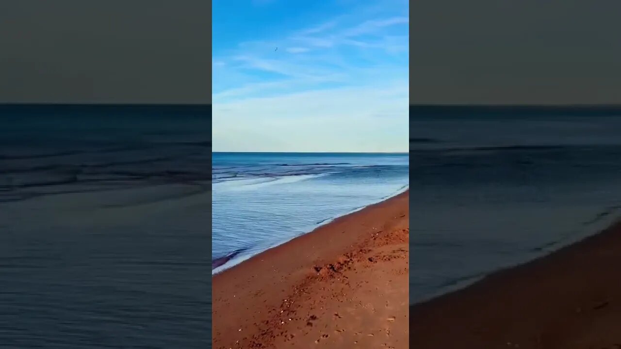 Calm water on a red beach