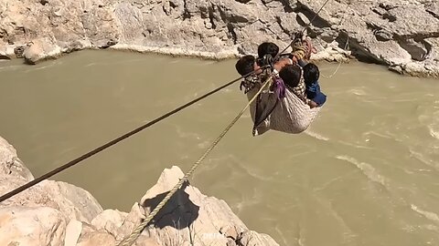 Nomadic village life, women and children crossing the river without equipment is terrible.