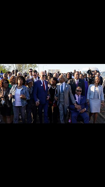 Biden and Al Sharpton Marching holding hands and marching in Selma. Pandering 101