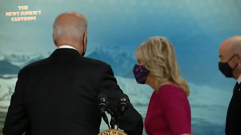 Biden walks away after telling the press: "Excuse my back."