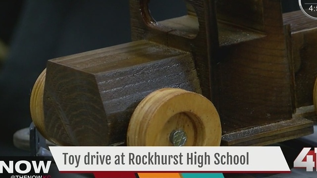 Rockhurst HS students build toy trucks for children in need for the holidays