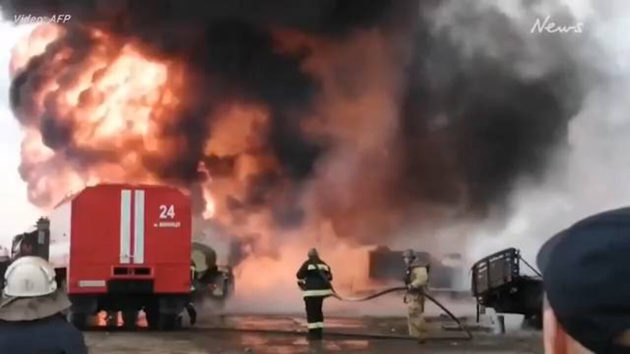Ukrainian firefighters try to put out fire after Russia missile attack