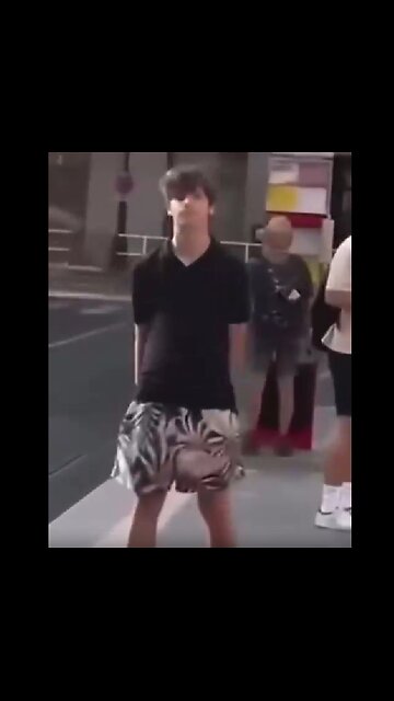 At a tram stop in Prague, an odd guy began to harass a pregnant woman..