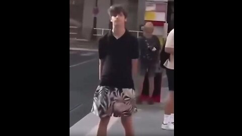 At a tram stop in Prague, an odd guy began to harass a pregnant woman..