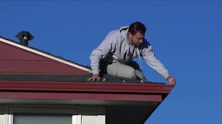 Volunteer brightening the homes of seniors during the holiday season