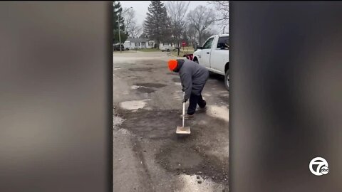 Waterford man goes on pothole patrol, patches neighborhood road