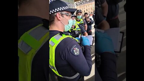 Police arresting and processing protestors at Flinders Street, Melbourne