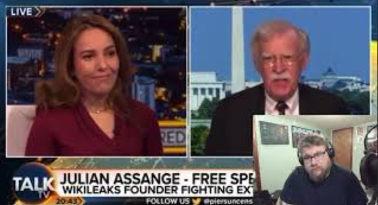 Julian Assange's wife Calls John Bolton a “War Criminal" to his Face