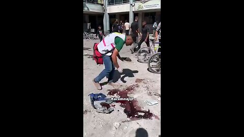 Palestinians pick up the scattered & blasted remains of children murdered by the israelis during the