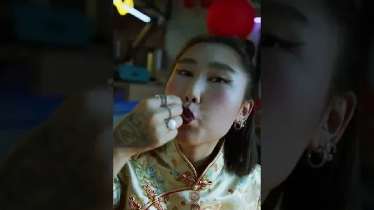 Cute Chinese woman devouring noodles