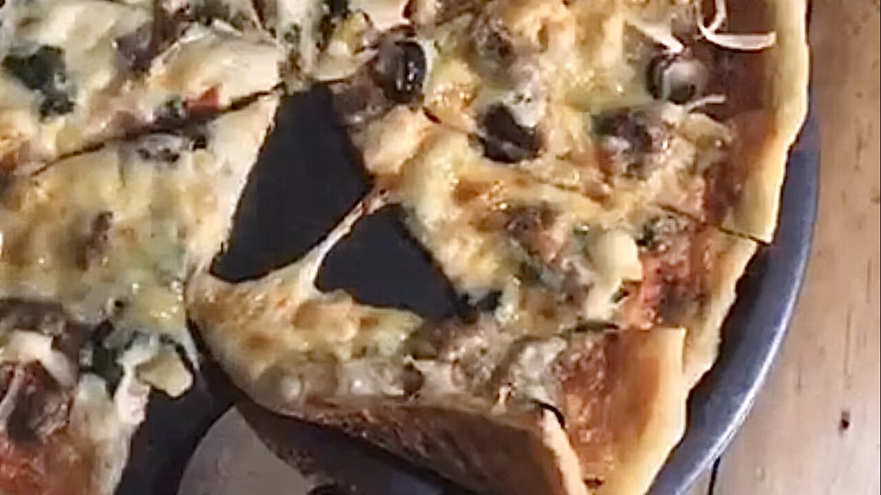 Thin Foldable Golden Pizza Made From Tube Dough