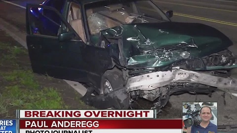 Police searching for people after a car they were chasing crashed into an innocent motorist