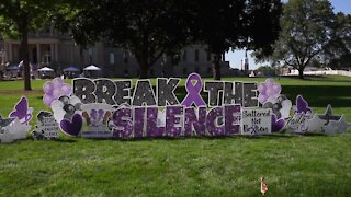 Friends of mother and daughter killed in Lansing speak at domestic violence rally