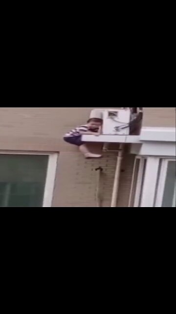 Man catches toddler falling from fifth floor in China #Short #Viral #Trending #Shorts