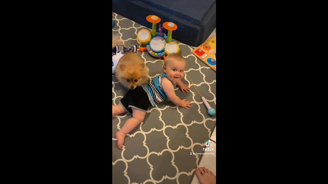 Baby is showing his Puppy how he can dance!