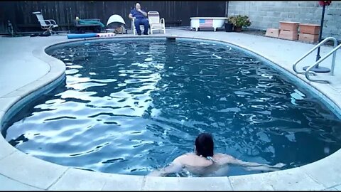 Bikini Clad woman goes for her evening swim - time lapse