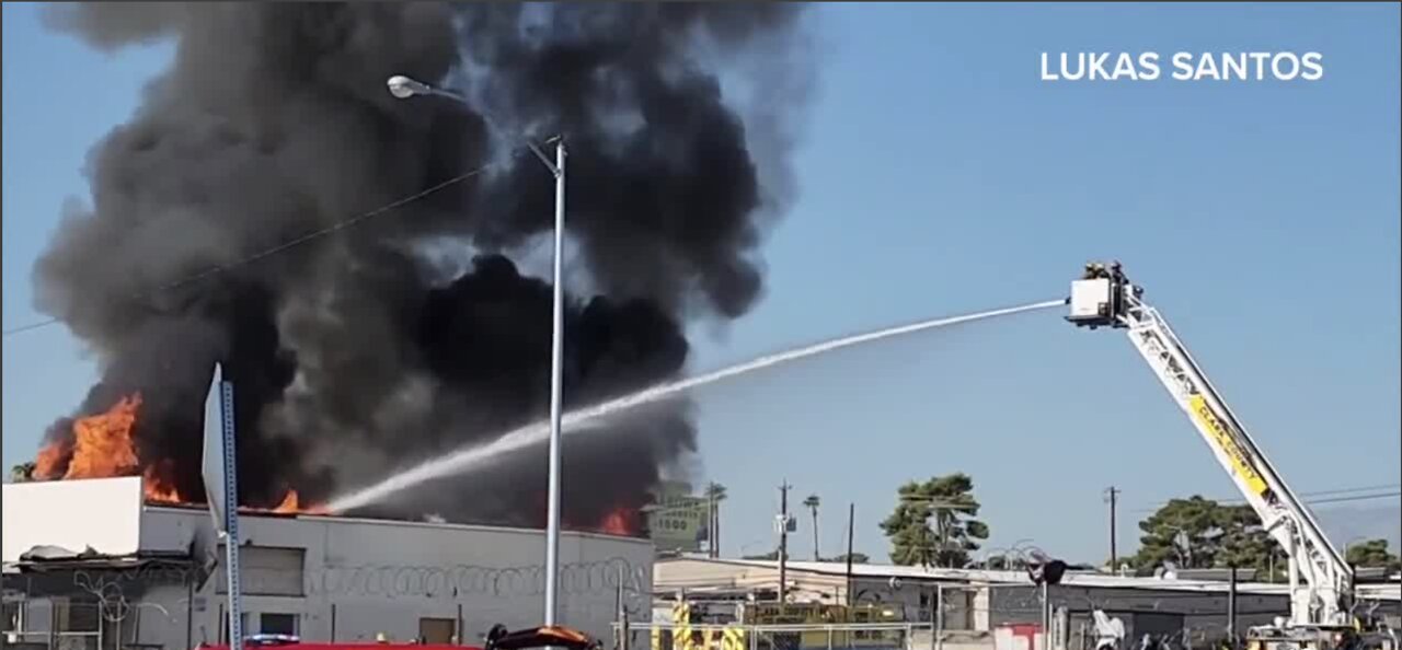 Flames engulf vacant building west of I-15 in Las Vegas