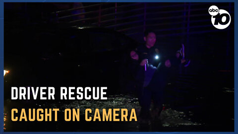 Driver rescued after car gets stuck in standing water