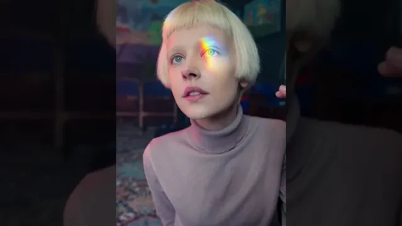 Rainbow colored reflection on human's face