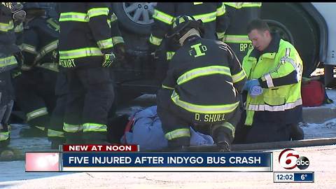 Four people injured in crash between an IndyGo bus and a Chrysler Sebring