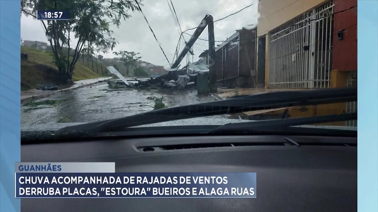 Guanhães: Chuva acompanhada de rajadas de ventos derruba placas, estoura bueiros e alaga ruas.