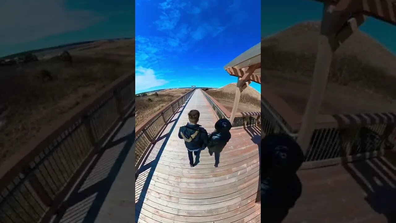 Walking by large sand dunes on the beach