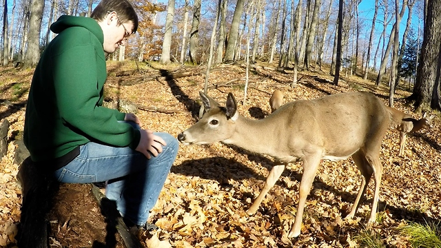 Young man shares unforgettable moment with wild deer