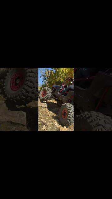 Jeep Climbing Up Rock Hill