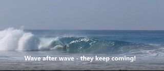 Surfers on Zicatela Beach in Puerto Escondido, Mexico