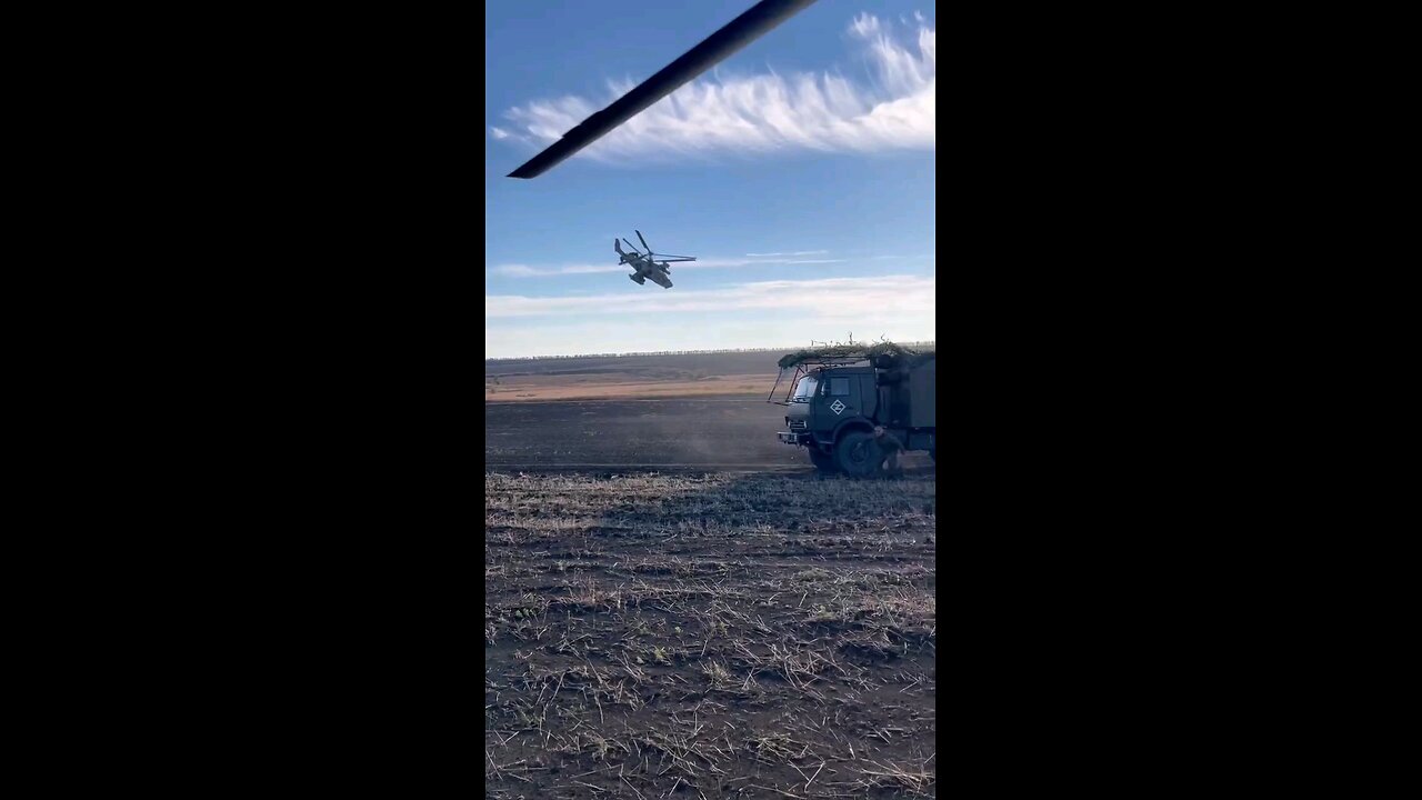 A Kamov Ka-52 circles a friendly position keeping it under surveillance.