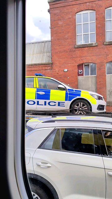 Police car being towed