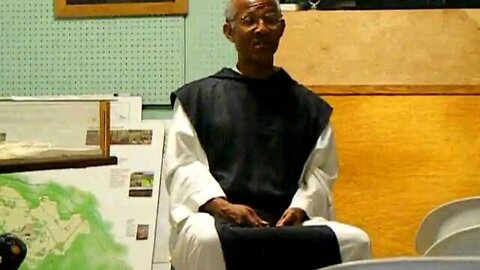 A monk presents some info.AVI