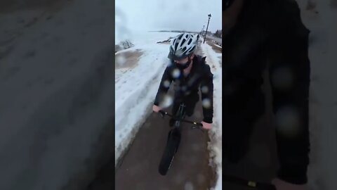 Riding over a puddle on a fat bike