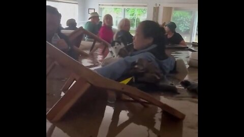 Creepy & Sureal Video Shows Hurricane Survivors Silently Standing In Chest-Deep Water In Their House