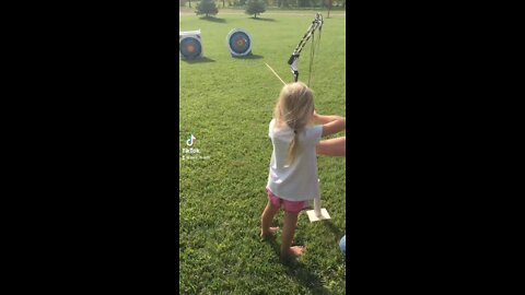 Girls shooting bows