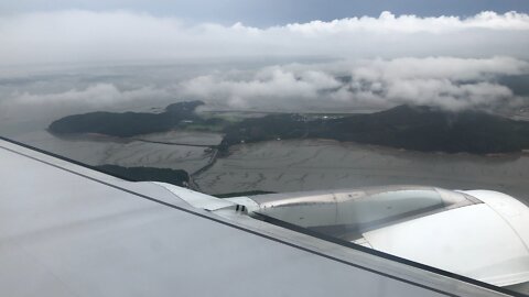 Flying over farmland in Korea and landing