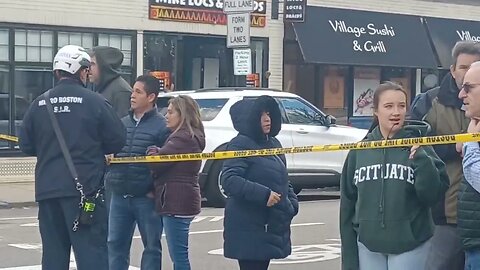 Boston police and fire dealing with a car that ran into a building in Roslindale