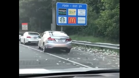 Money Scattered All Over The Road