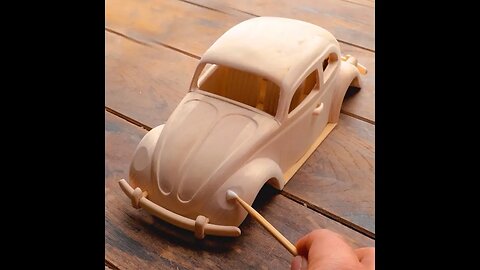 Realistic car made of wood. Watch with sound