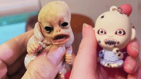 Sasuke and Daisy open zombie babies and figural bag clips from Spirit Halloween!