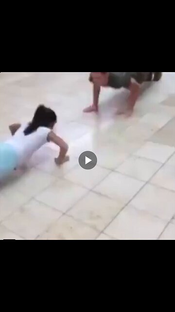 Little girl faces Marine in push-up contest