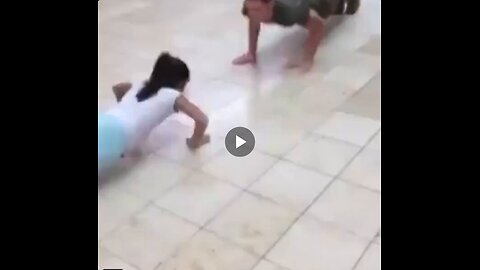 Little girl faces Marine in push-up contest