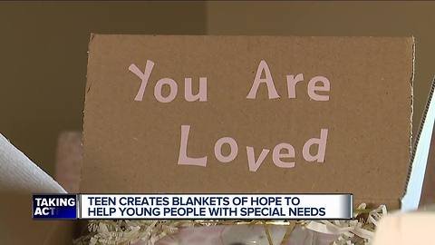 14-year-old Emily McCulloch uses blankets to lift up kids with special needs