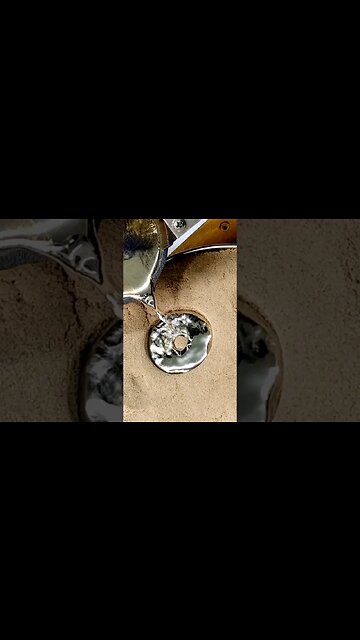 Pouring Molten Metal on Sand