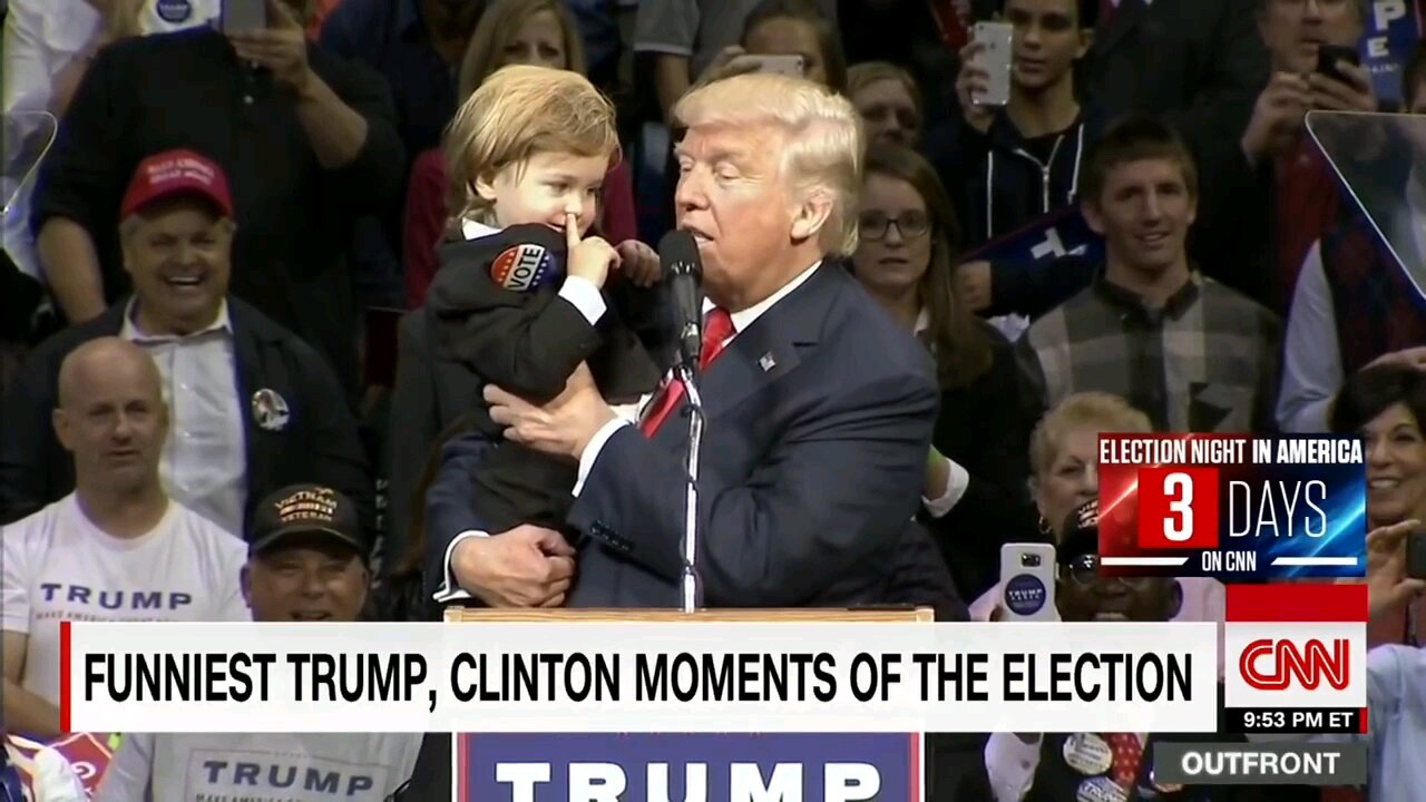 Donald Trump Holds child at press conference