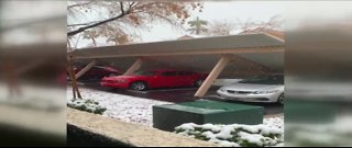 Carport collapses, traps multiple cars