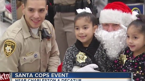 Santa flies to Walmart in police helicopter for Santa Cops event