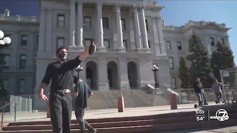 Residents gather at Capitol to celebrate, protest transition of power; 2 arrested for gun violations