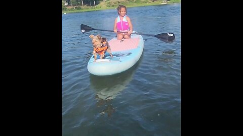my granddaughter learning to paddleboard