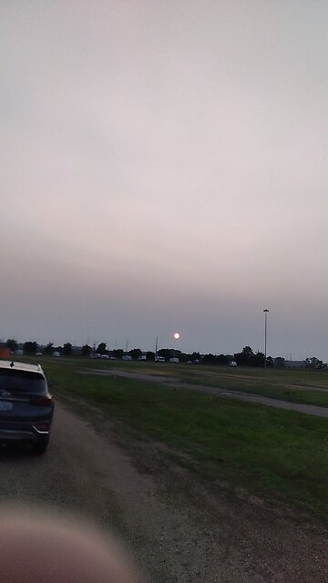 sun behind the smog is dope